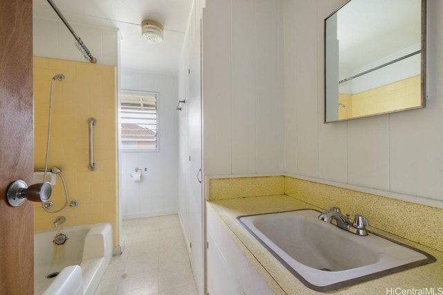 bathroom featuring tiled shower / bath and sink