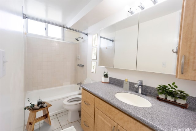 full bathroom with tiled shower / bath, vanity, toilet, and tile patterned flooring