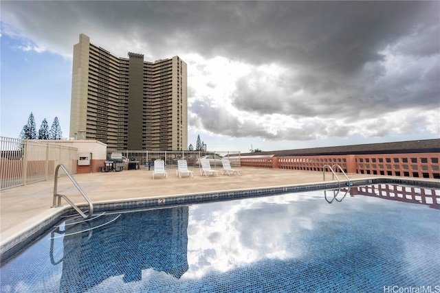 view of swimming pool featuring a patio