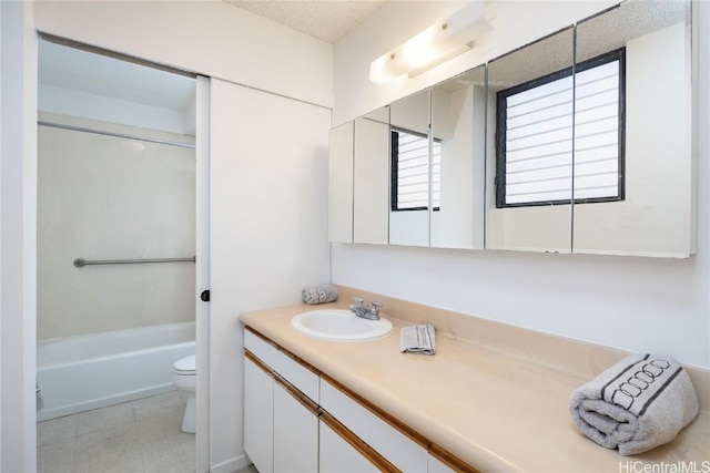 bathroom featuring toilet, tile patterned flooring, a textured ceiling, vanity, and shower / bathing tub combination