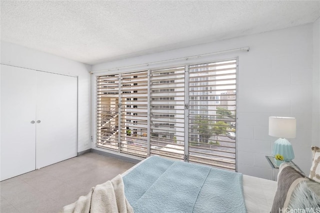 bedroom featuring a closet and a textured ceiling