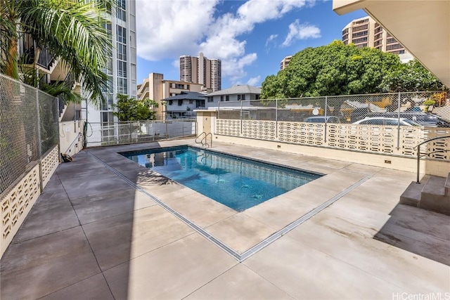 view of pool featuring a patio