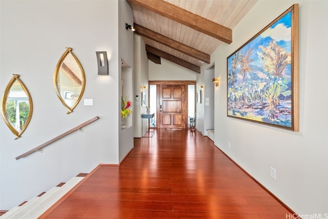 hallway featuring dark wood-type flooring, wooden ceiling, and vaulted ceiling with beams