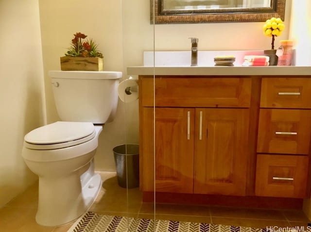 bathroom featuring vanity, toilet, and tile patterned flooring