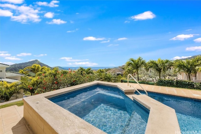 view of swimming pool featuring a mountain view