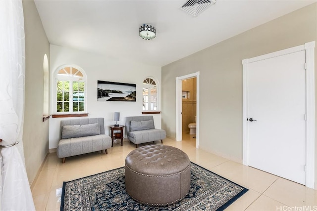 living area with light tile patterned floors