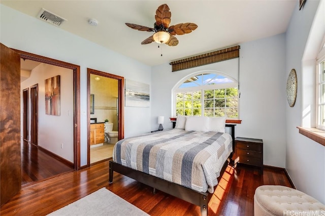 bedroom featuring dark wood-type flooring, ceiling fan, and connected bathroom