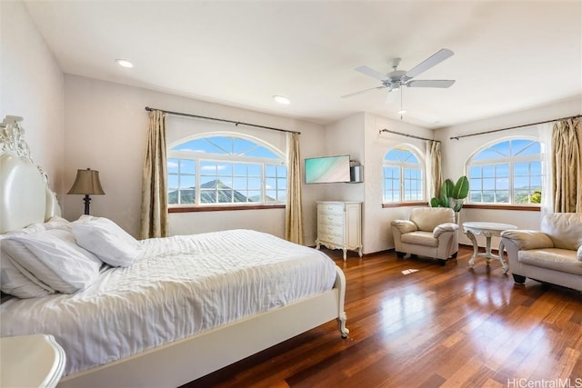 bedroom featuring dark hardwood / wood-style floors and ceiling fan