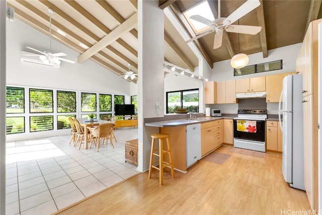 kitchen with white appliances, light brown cabinets, kitchen peninsula, ceiling fan, and beam ceiling