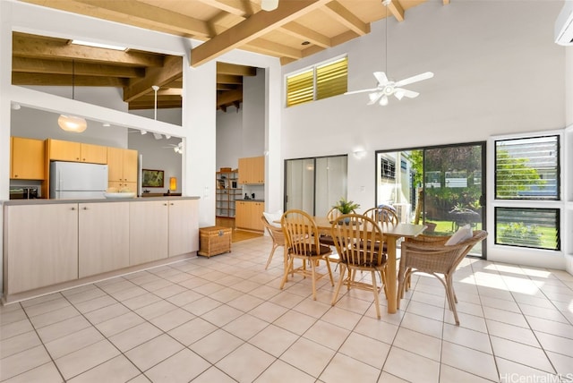 tiled dining room with beamed ceiling, ceiling fan, a wall mounted air conditioner, and high vaulted ceiling