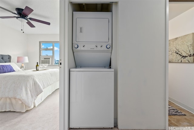 laundry room with cooling unit, ceiling fan, and stacked washing maching and dryer