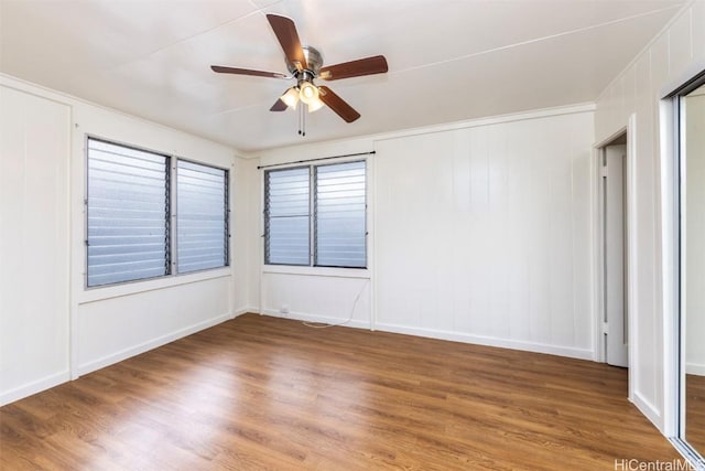 unfurnished room featuring hardwood / wood-style floors and ceiling fan