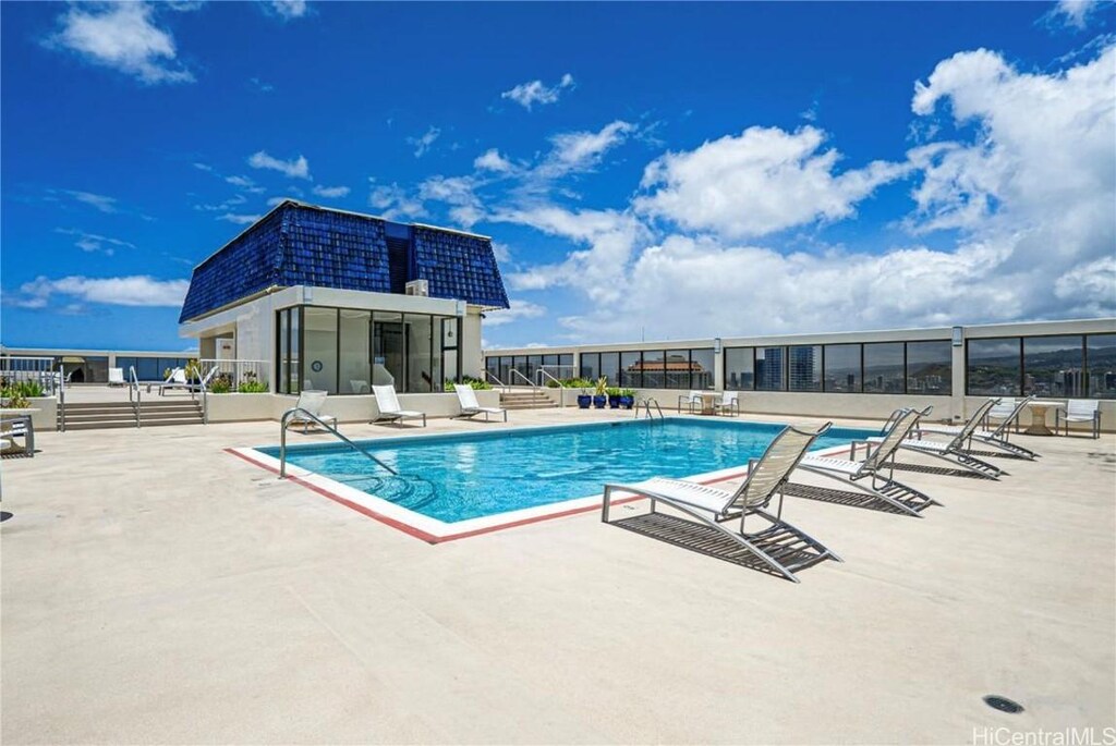 view of swimming pool with a patio