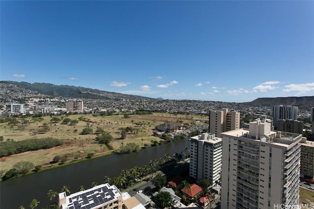 drone / aerial view with a water and mountain view