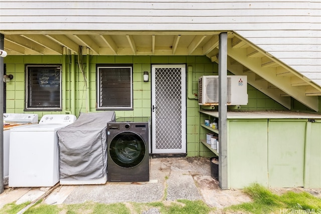 exterior space with separate washer and dryer