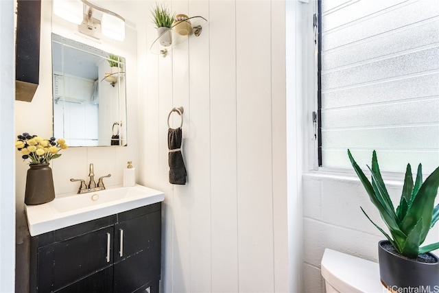 bathroom featuring vanity and toilet