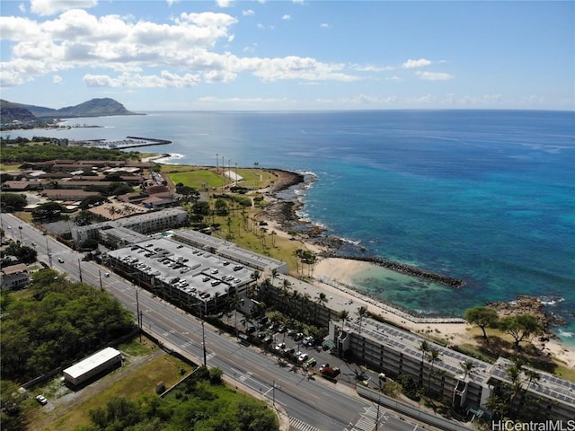 bird's eye view featuring a water view and a beach view