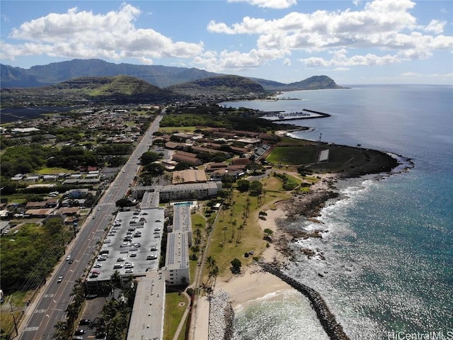 drone / aerial view featuring a water and mountain view