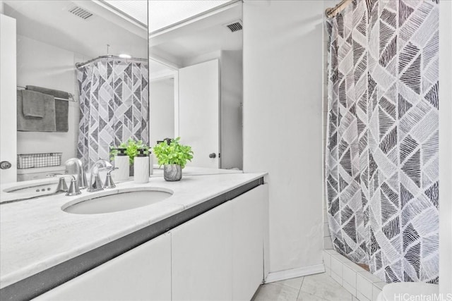 bathroom with tile patterned flooring, vanity, and a shower with shower curtain