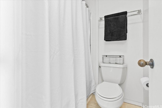 bathroom featuring tile patterned flooring and toilet