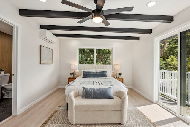 bedroom featuring access to exterior, beamed ceiling, a wall mounted AC, and light wood-type flooring