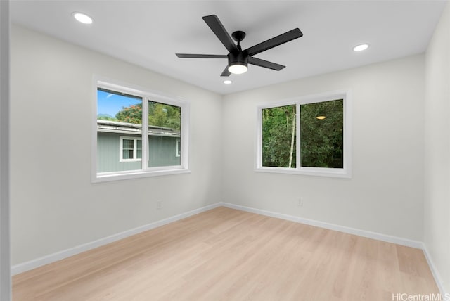 empty room featuring ceiling fan and light wood-type flooring