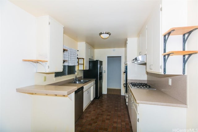 kitchen featuring sink, stainless steel appliances, and white cabinets