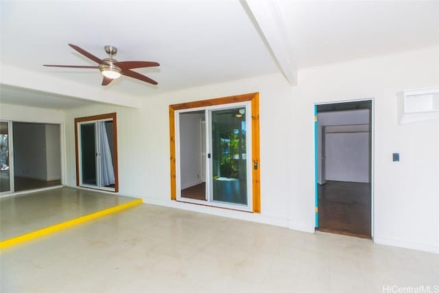 unfurnished room featuring beamed ceiling and ceiling fan