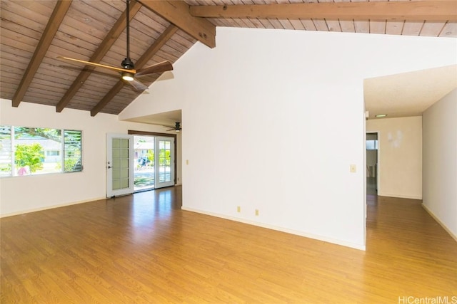 empty room featuring high vaulted ceiling, wood ceiling, beam ceiling, and light hardwood / wood-style flooring