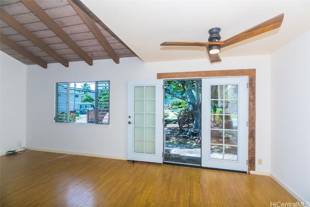 doorway with ceiling fan, hardwood / wood-style flooring, lofted ceiling with beams, and wooden ceiling