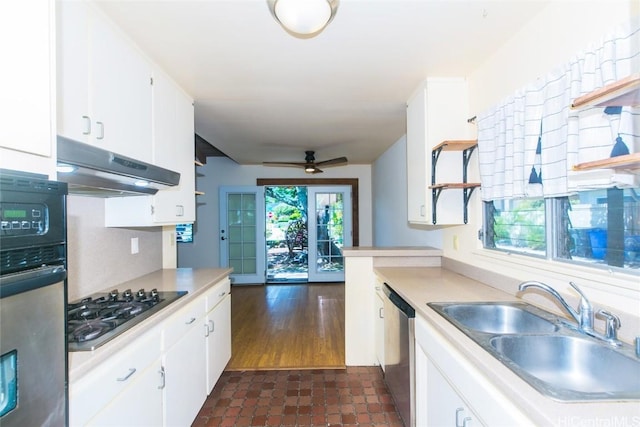 kitchen featuring plenty of natural light, appliances with stainless steel finishes, sink, and white cabinets