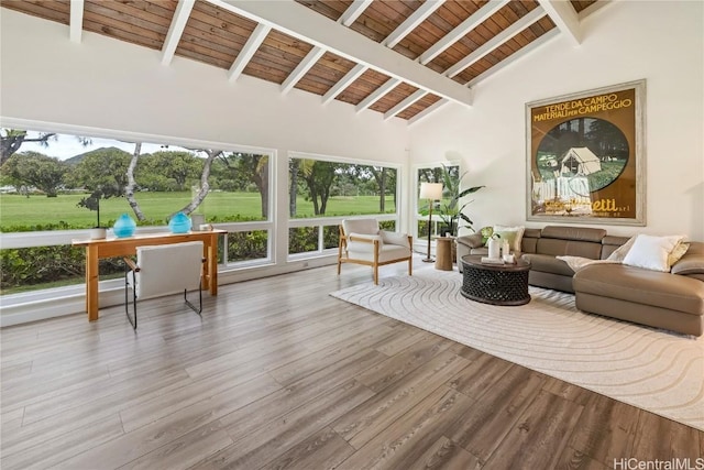 sunroom / solarium with vaulted ceiling with beams and wooden ceiling