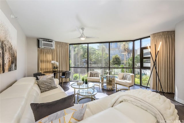 living room with hardwood / wood-style floors, floor to ceiling windows, a wall mounted air conditioner, and ceiling fan