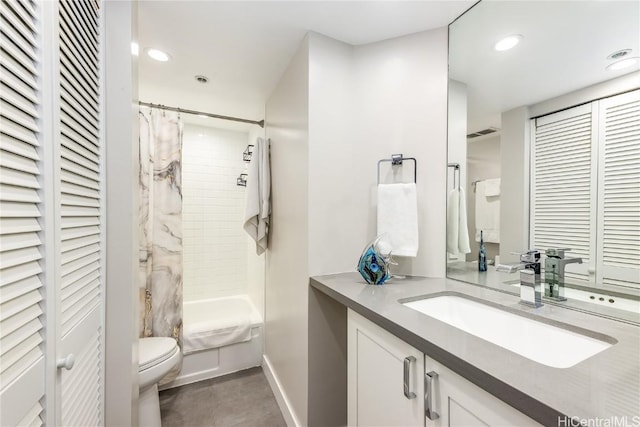 full bathroom with vanity, shower / bath combo, and toilet