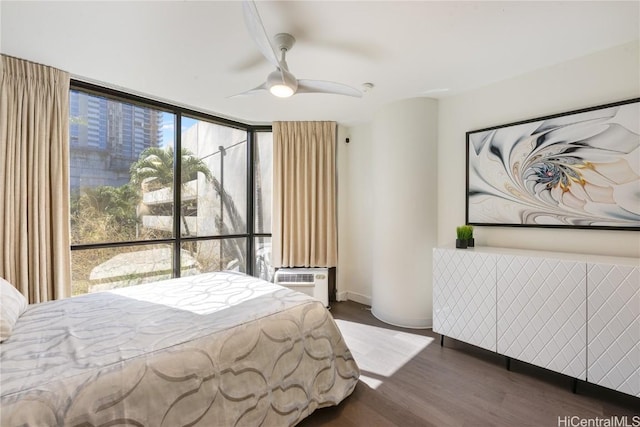 bedroom featuring floor to ceiling windows, dark hardwood / wood-style floors, and ceiling fan