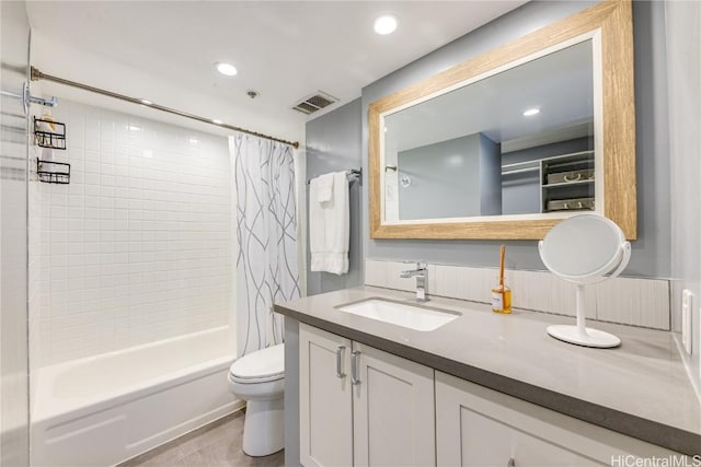 full bathroom with vanity, toilet, and shower / bath combo with shower curtain