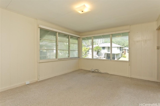 unfurnished room with light colored carpet