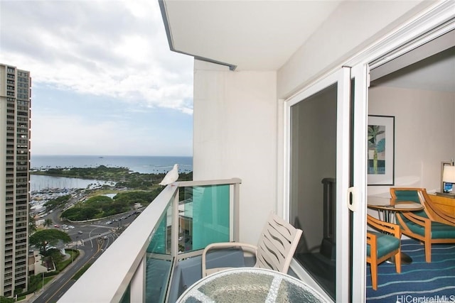 balcony featuring a water view