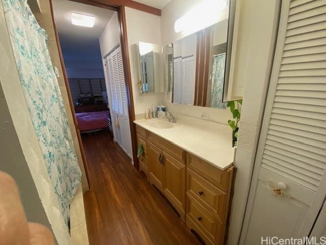 bathroom featuring vanity and hardwood / wood-style floors