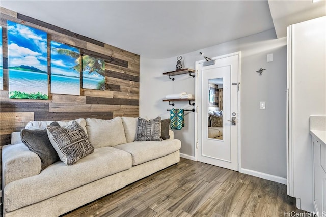 living room featuring wood-type flooring and wood walls