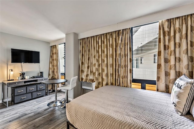 bedroom with wood-type flooring