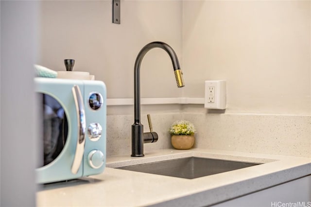 details with sink and decorative backsplash