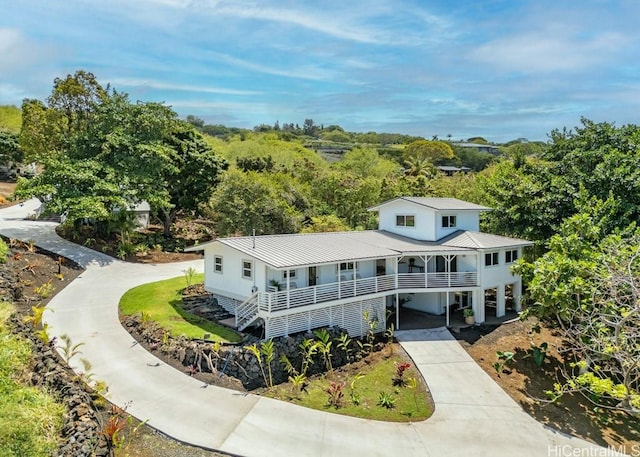 view of front of property featuring a carport