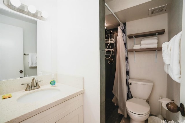 bathroom with toilet, vanity, and a shower with curtain