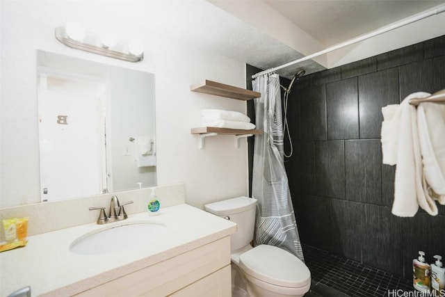 bathroom featuring vanity, toilet, and a shower with shower curtain