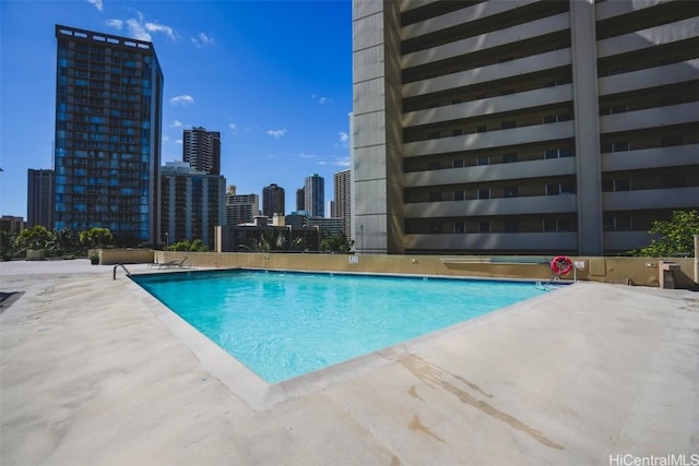 view of pool featuring a patio