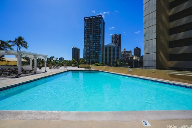 view of swimming pool featuring a pergola