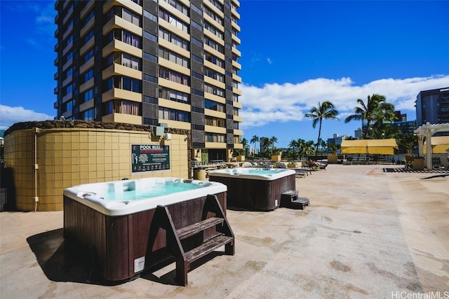 view of patio / terrace featuring a hot tub