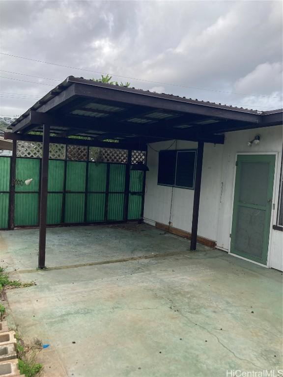 view of patio / terrace featuring a carport