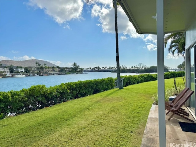 view of yard with a water and mountain view